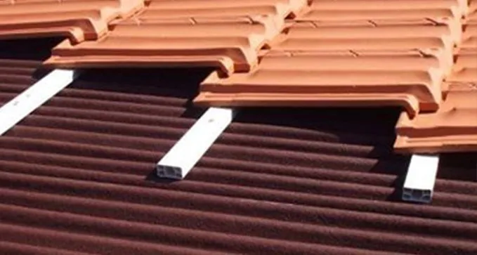 Montaje de Onduline bajo teja en Cervera de Pisuerga palencia